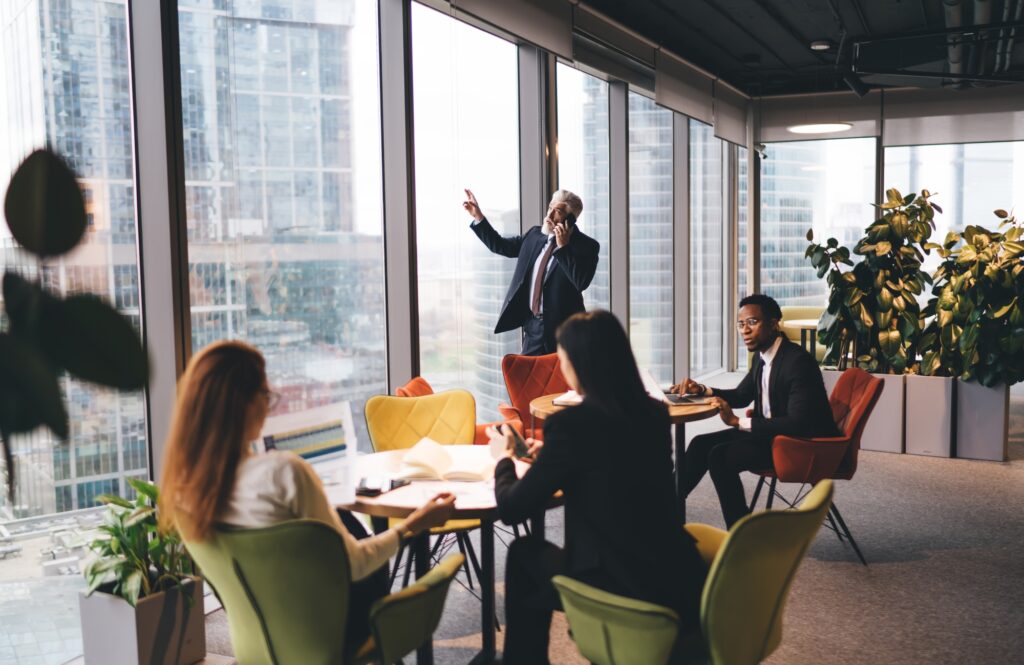 Group of diverse colleagues working hard in office